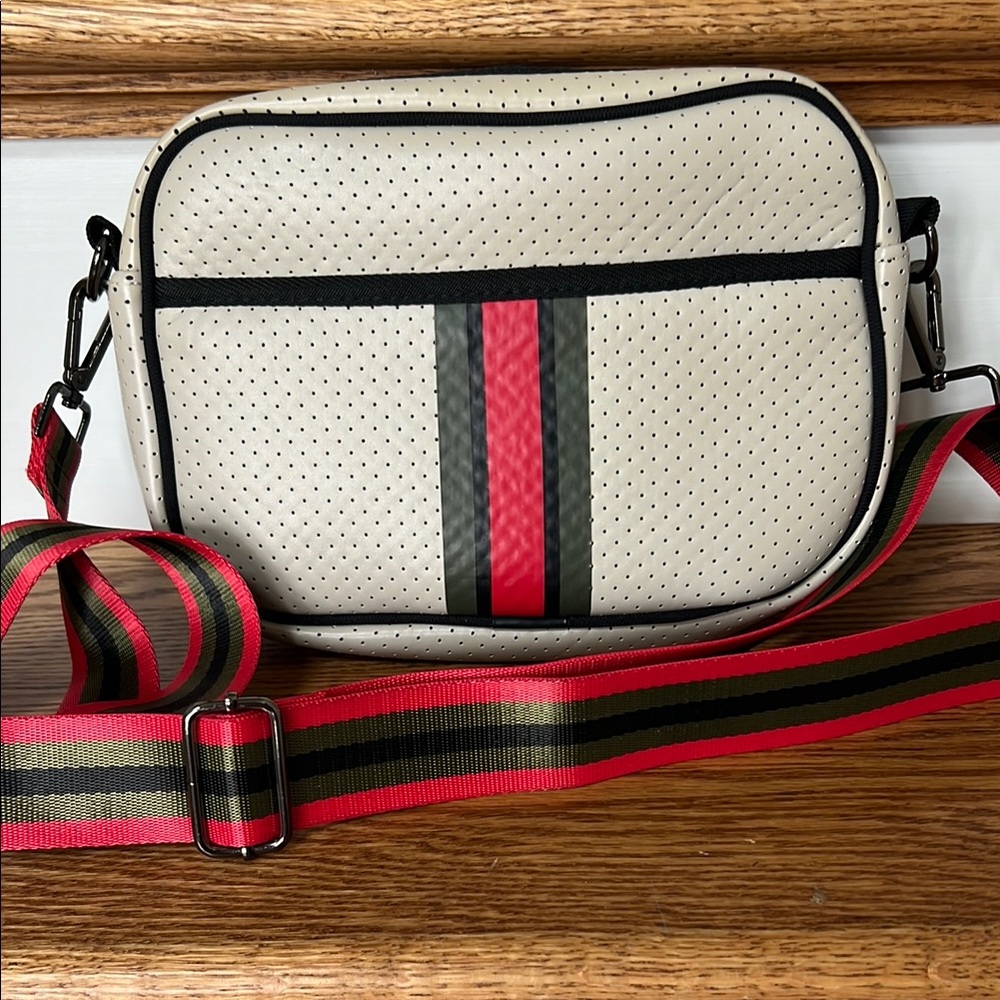 HAUTE SHORE Beige Crossbody Bag with Red and Black Accents